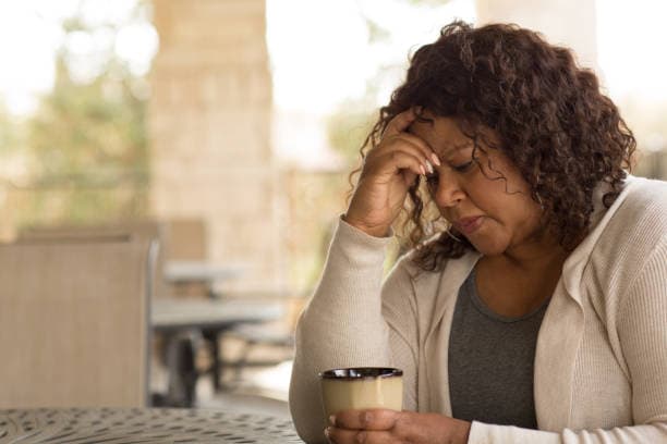 Woman experiencing anxiety during menopause