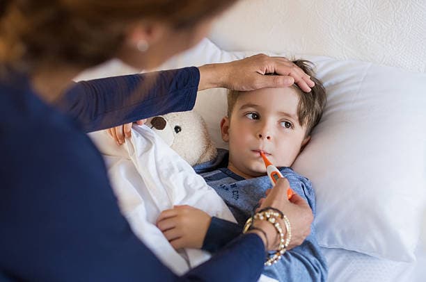 Child with flu symptoms resting