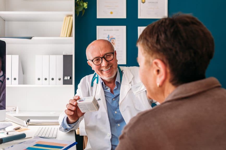 Senior discussing COPD symptoms with doctor