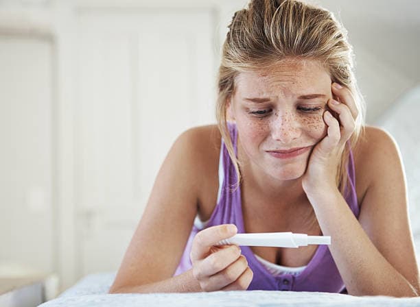 Young woman practicing a daily routine during teenage pregnancy