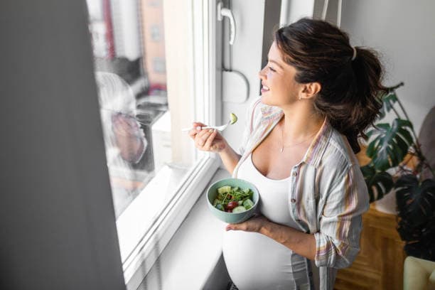 Teen eating a nutritious meal during teenage pregnancy