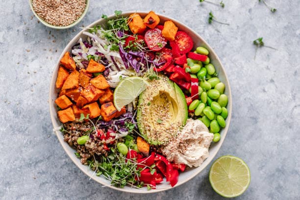 A vibrant plate of healthy dinner recipes featuring vegetables, lean proteins, and whole grains