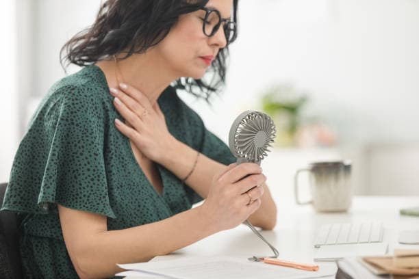 Woman experiencing hot flash