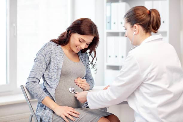 Hero Image of Pregnant Woman with Doctor