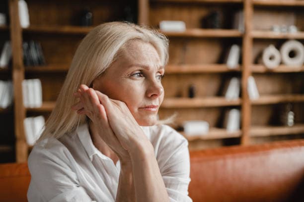 Woman reflecting on thoughts during menopause