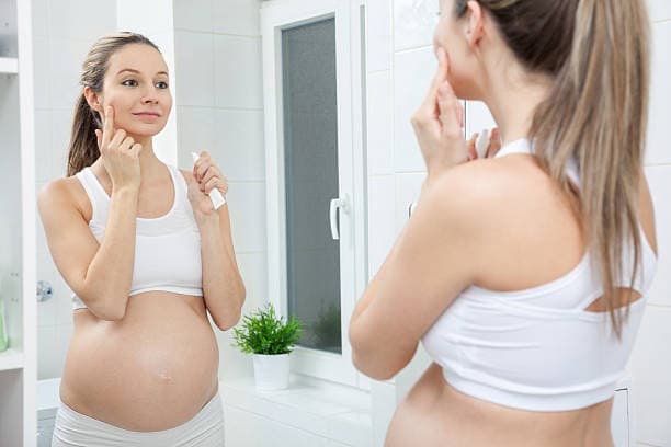 Pregnant woman resting with remedies