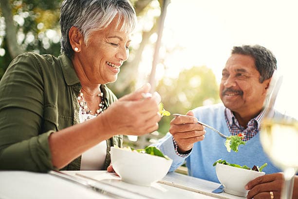 Senior enjoying a balanced meal for nutrition for elderly health
