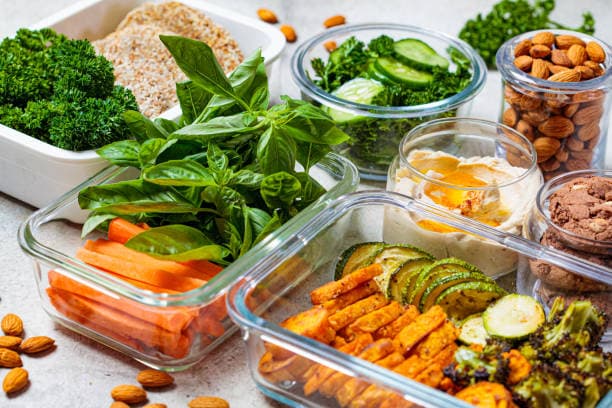 Quick healthy lunch ideas with a fresh salad bowl full of colorful veggies and proteins