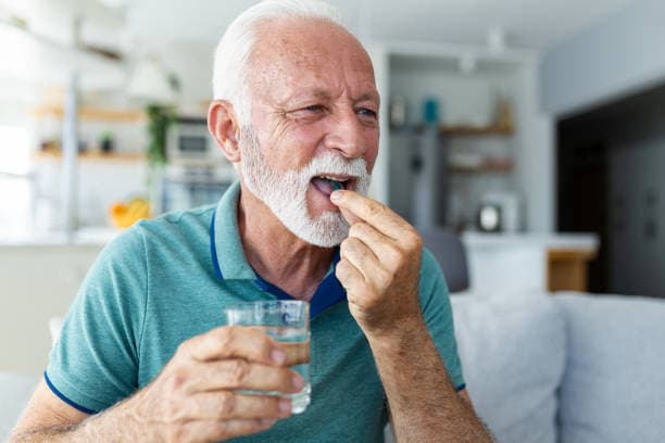 Elderly person with senior nutrition supplements for daily health