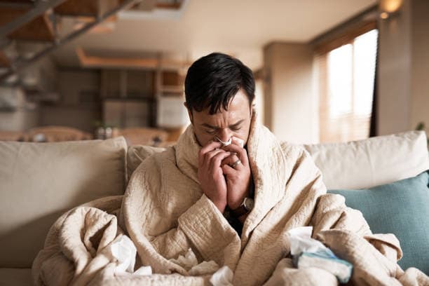 Person experiencing severe flu symptoms