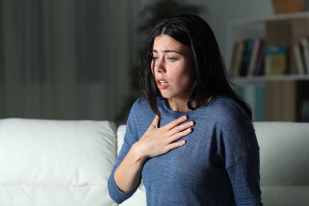 Person experiencing shortness of breath anxiety
