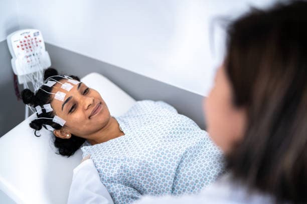 Doctor discussing sleep apnea diagnosis with adult patient
