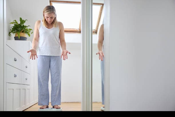 Woman managing weight gain during menopause