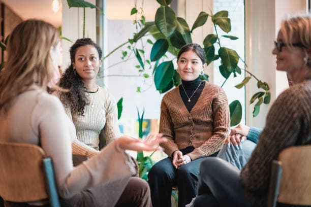 Group therapy session for young mothers