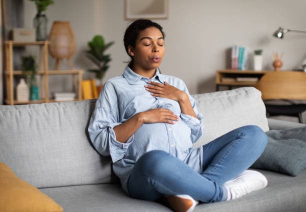 Itchy nipples early pregnancy symptom with a pregnant woman practicing self-care